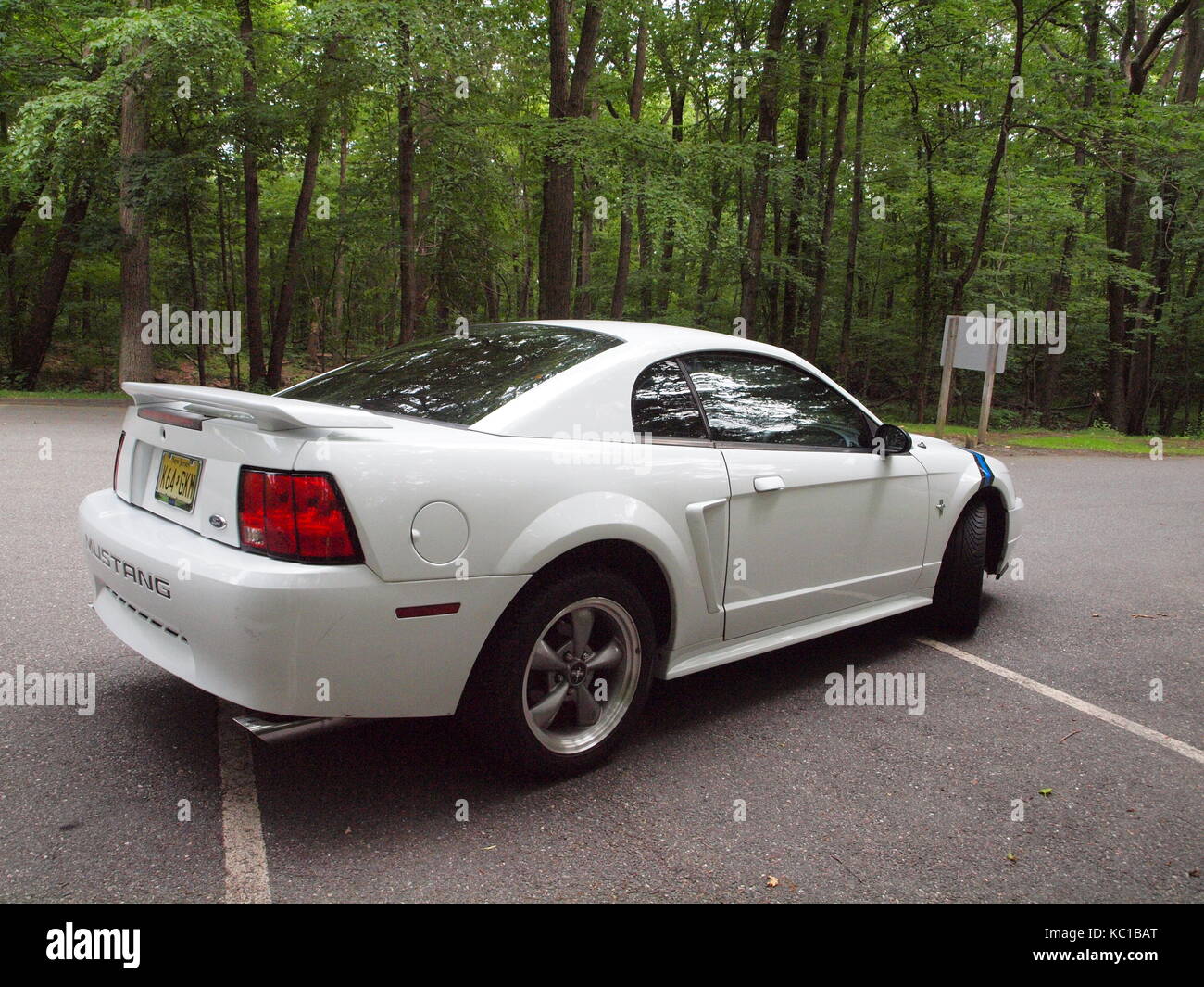 White Mustang at Morris County NJ park showing off wide wheels and tires. Fords hit pony car was introduced in 1964 and has sold over 9 million. Stock Photo