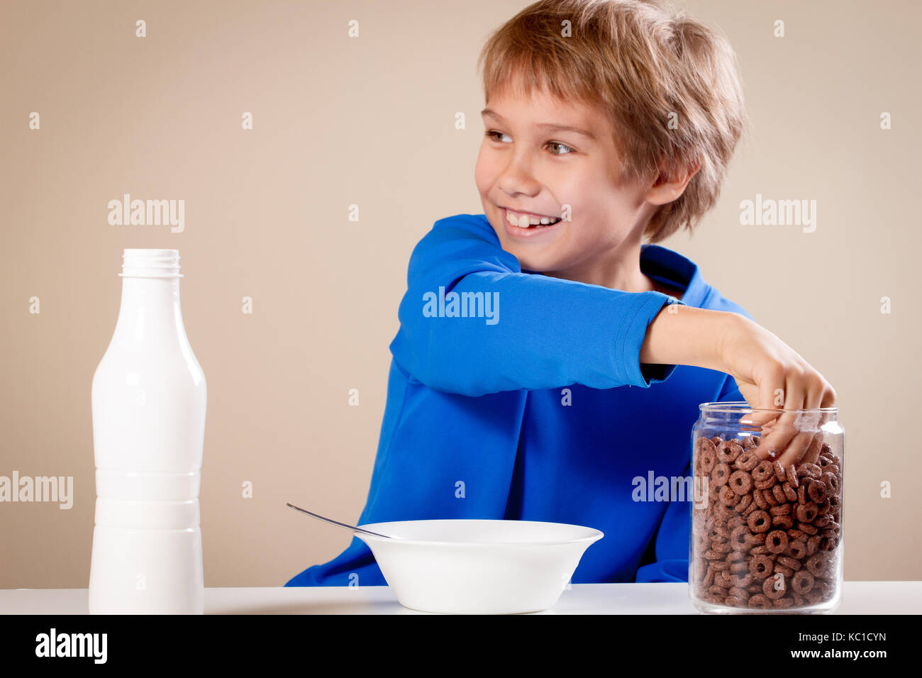Child eating cereal with milk for breakfast at home Stock Photo Alamy