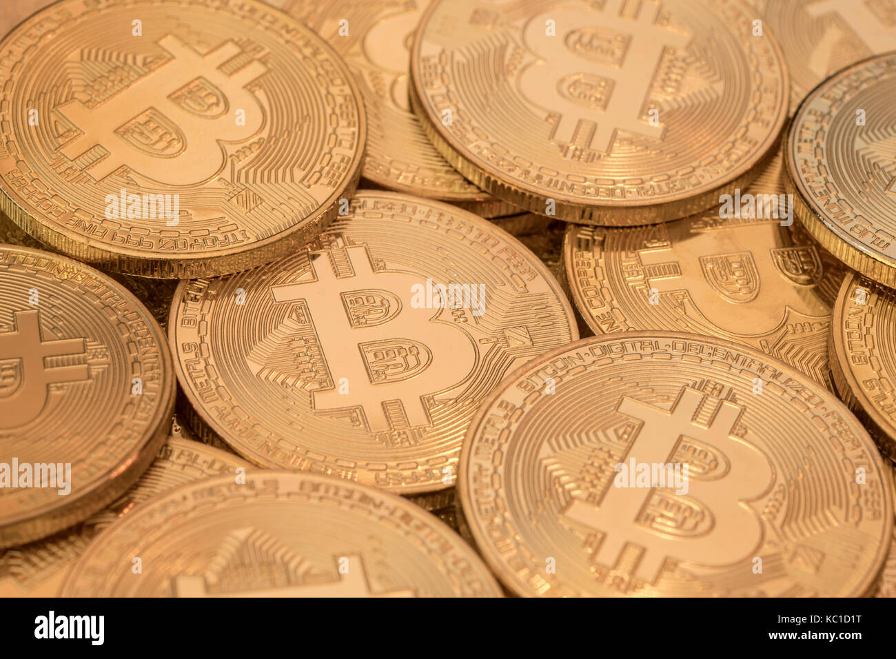 Gold Bitcoins as metaphor for concept of virtual currency, peer to peer digital payment, darkweb cybercrime, general cryptocurrencies, & exchange rate Stock Photo