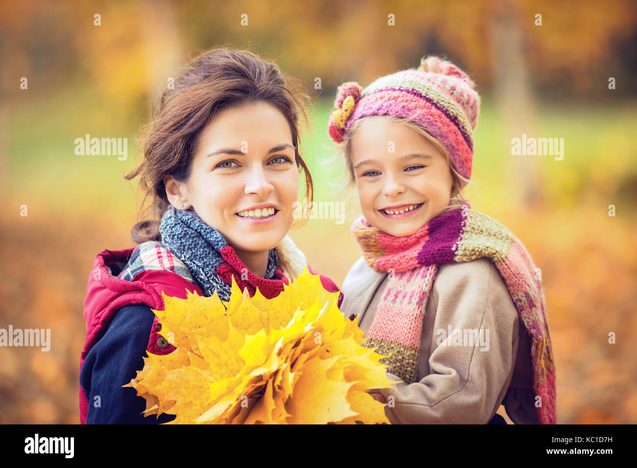 Mother and daughter in the autumn park Stock Photo - Alamy
