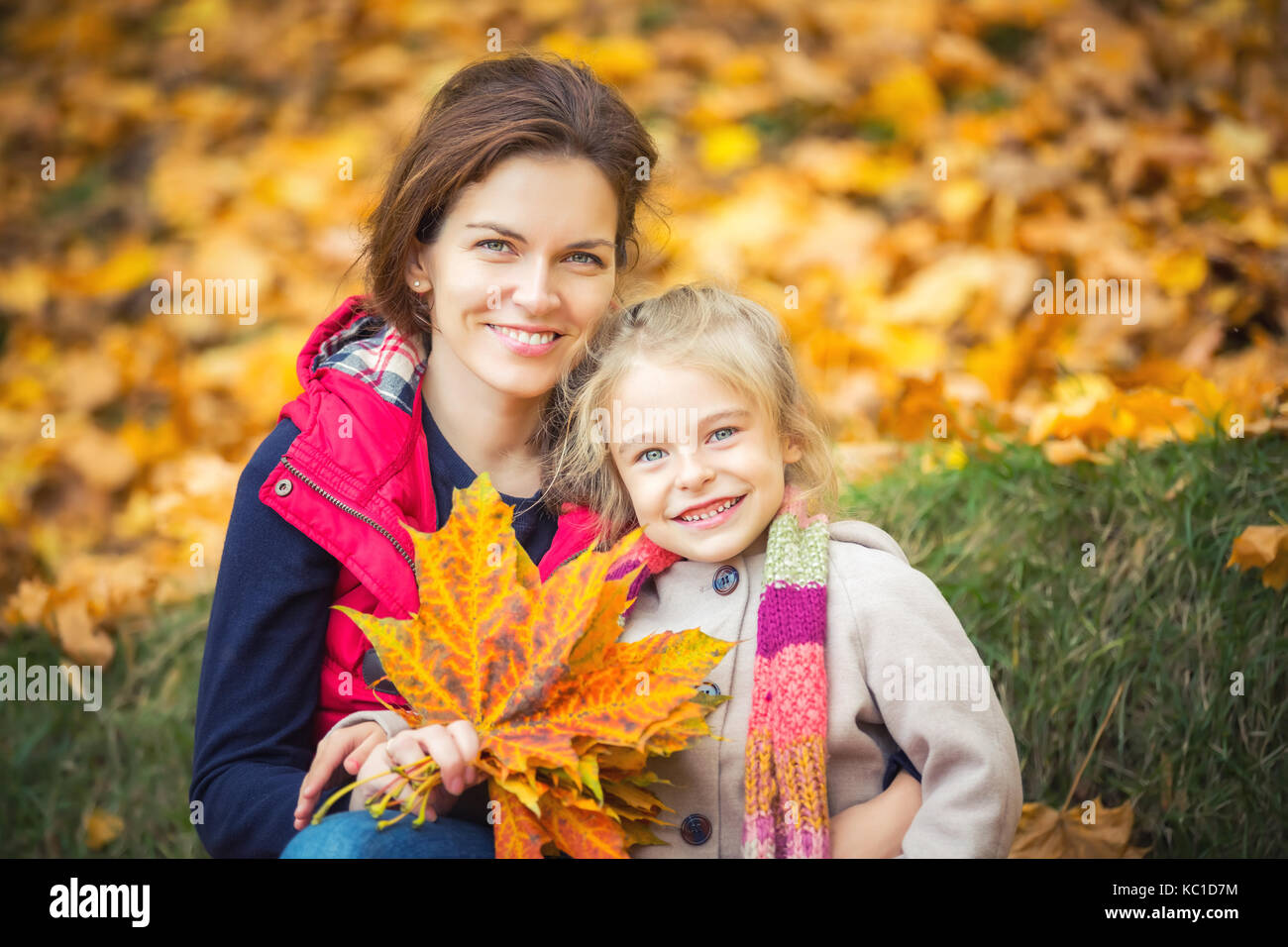 Mother and daughter in the autumn park Stock Photo - Alamy