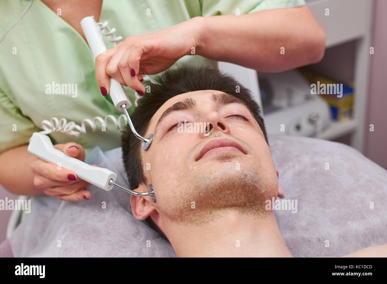 Face of man, microcurrent therapy. Stock Photo
