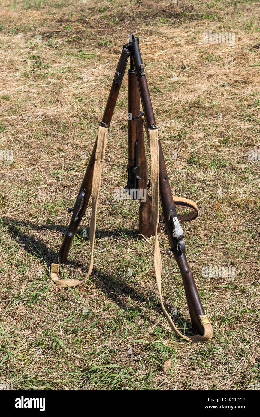 American rifle M1 Garand. Pyramid of weapons in the military camp. Stock Photo