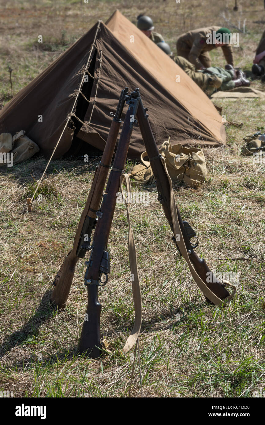 American rifle M1 Garand. Pyramid of weapons in the military camp. Stock Photo