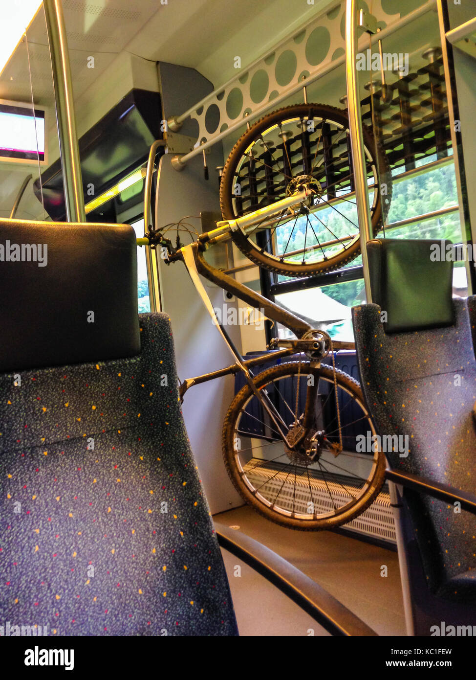 Bike hanging on the rack in the train. Providing bicycle lover an ...