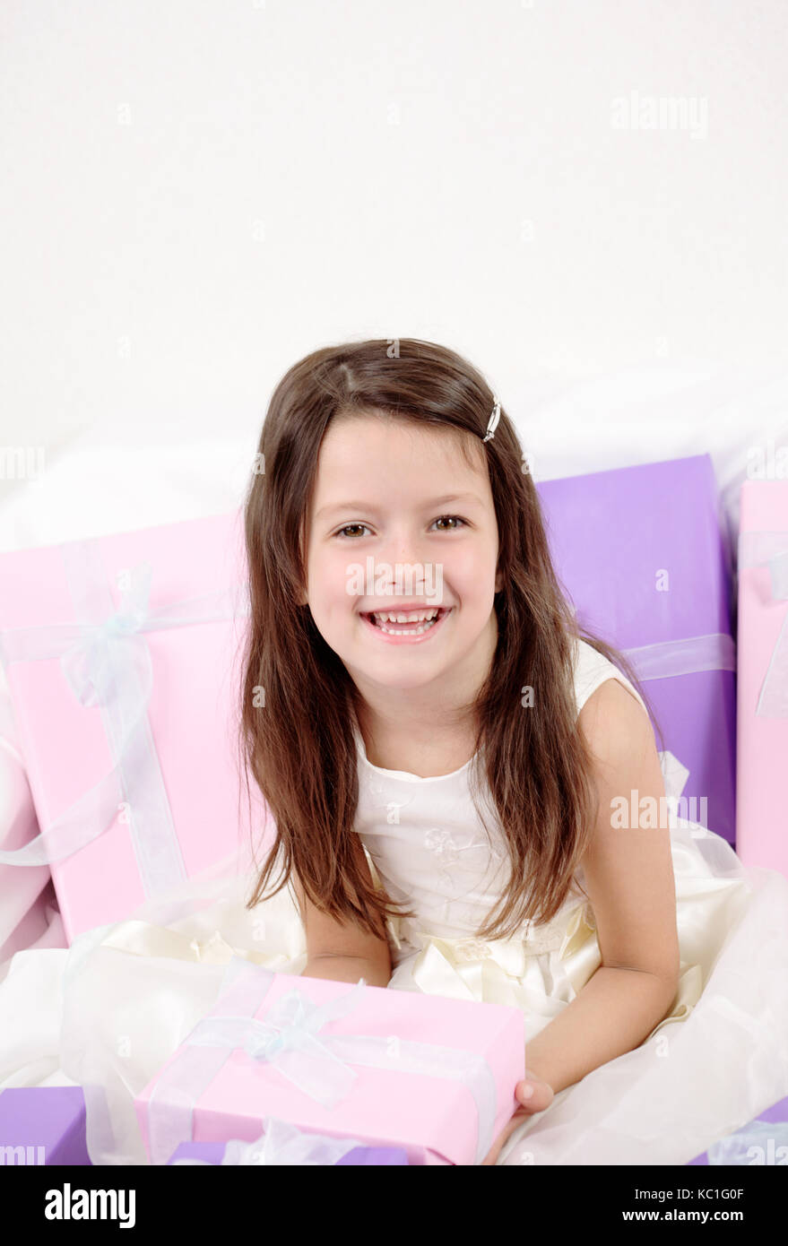 Little girl holding a present Stock Photo - Alamy