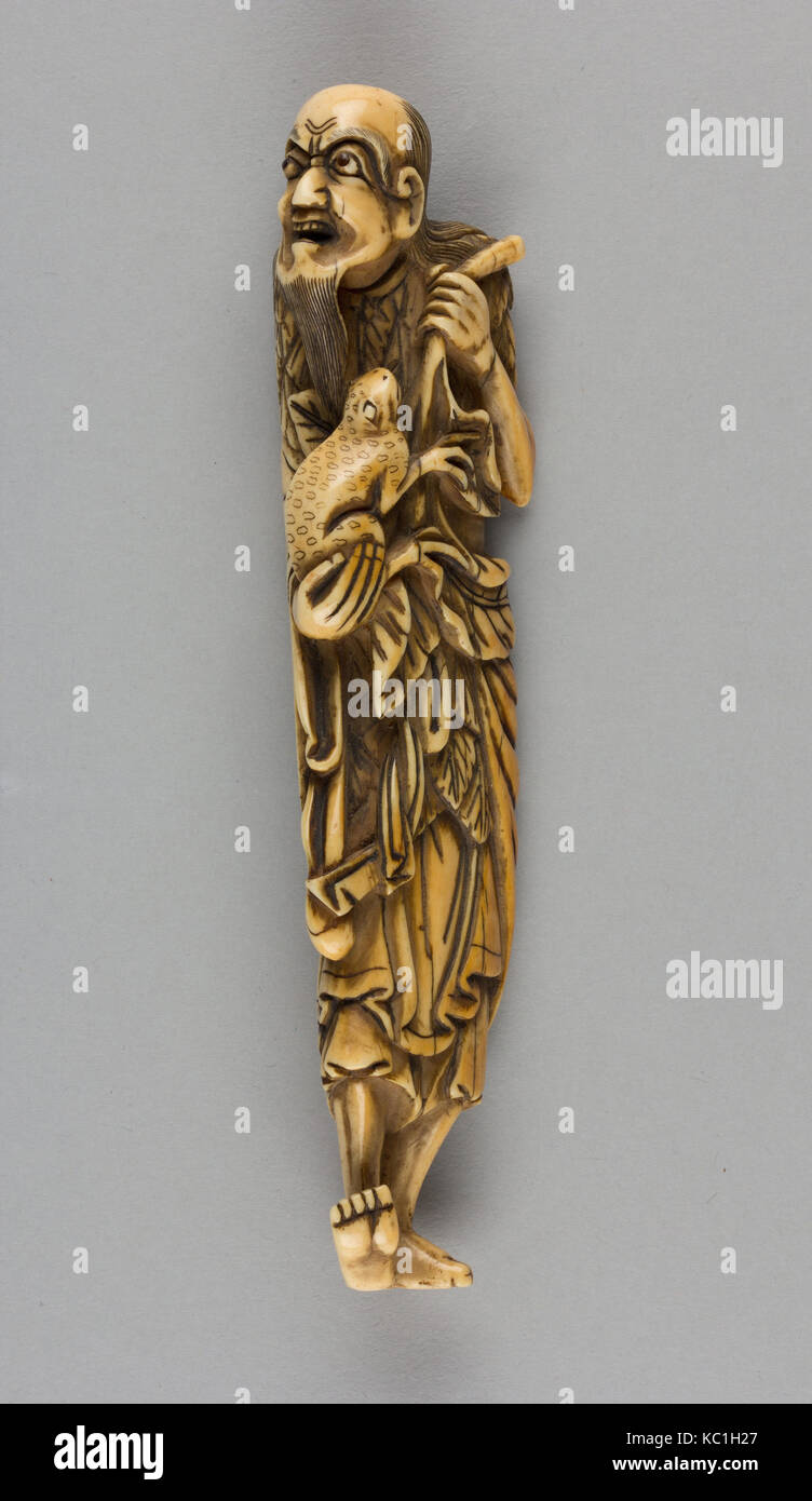 Netsuke of Man Carrying a Frog in One Hand and a Branch in the Other, 19th century Stock Photo