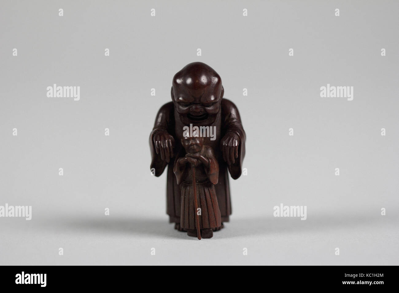 Netsuke of Ghost Trying in Vain to Frighten Blind Man, 19th century Stock Photo