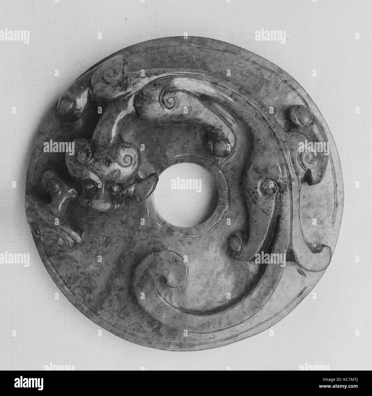 Disk, Han dynasty (206 B.C.–A.D. 220), China, Jade, Diam. 2 5/8 in. (6.7 cm); Th. 3/4 in. (1.9 cm), Jade Stock Photo