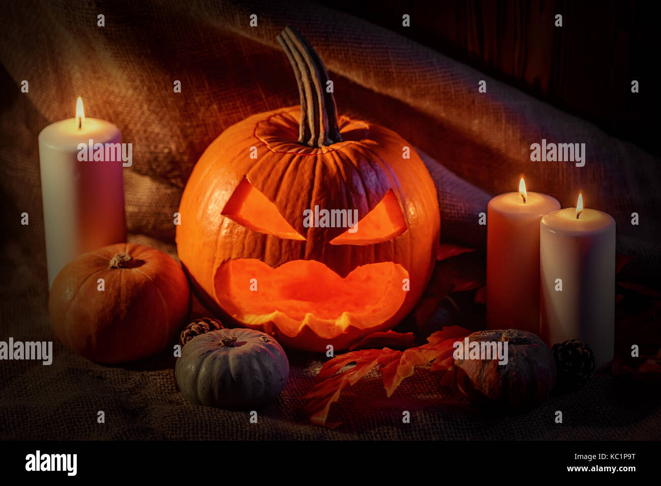Halloween pumpkin head with burning candles Stock Photo - Alamy