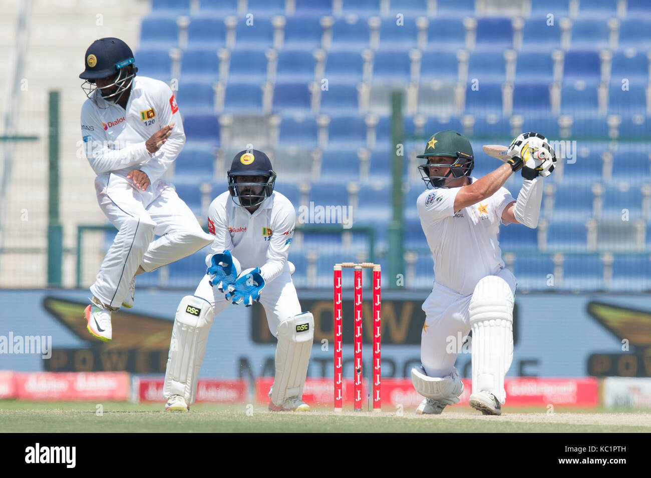 Abu Dhabi. 1st October, 2017. Yasir Shah (R) of Pakistan plays a shot during the fourth day of the first Test cricket match between Sri Lanka and Pakistan at Sheikh Zayed Stadium in Abu Dhabi on October 1, 2017 Credit: Isuru Peiris/Alamy Live News Stock Photo