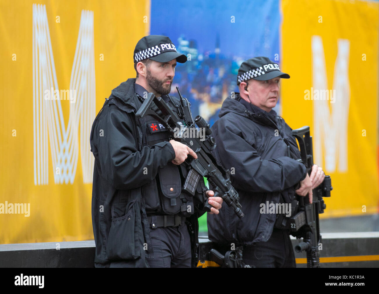 Authorised firearms officer (AFO)  a British police officer in Manchester, UK.  Weapons, policing, police, uniform, british, force, officer, law, armed, security, control, england, patrol, gun, weapon, firearm, military, handgun, pistol, security, crime, protection, patrol, enforcement, cop, crime, shot, danger, black uniforms, firearms and equipment of British Armed Police on duty at the at the Conservative Annual Conference, 2018. Stock Photo