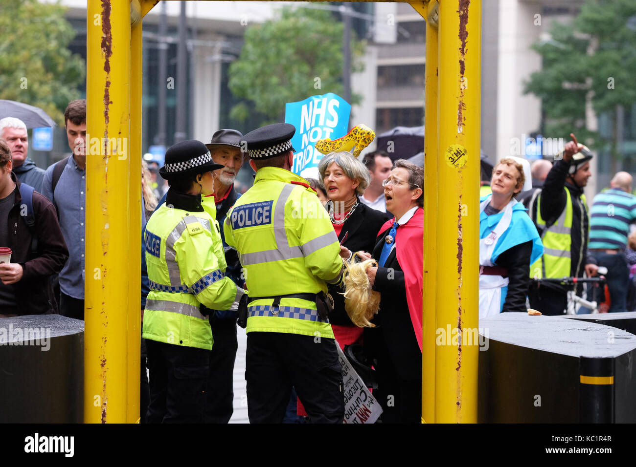 Manchester, UK. 1st October, 2017. Conservative Party Conference, Manchester UK, Sunday 1st October 2017 - A protester dressed to look like Theresa May talks with police before entering the zone in front of the Midland Hotel in the city centre on the opening day of the Conservative Party Conference. Credit: Steven May/Alamy Live News Stock Photo