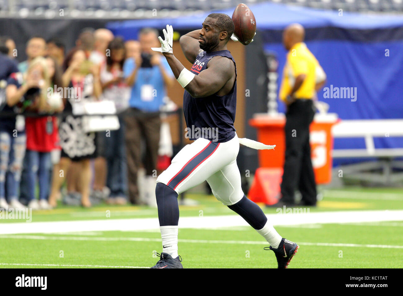 Houston, Texas, USA. 1st Oct, 2017. Houston Texans outside linebacker Whitney Mercilus (59, right) tosses a football during warmups prior to an NFL regular season game between the Houston Texans and the Tennessee Titans at NRG Stadium in Houston, TX on October1, 2017. Credit: Erik Williams/ZUMA Wire/Alamy Live News Stock Photo
