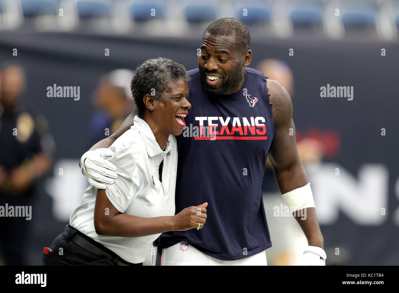 Houston, Texas, USA. 1st Oct, 2017. Houston Texans outside linebacker Whitney Mercilus (59, right) shares a light moment with an NRG Stadium worker prior to an NFL regular season game between the Houston Texans and the Tennessee Titans in Houston, TX on October1, 2017. Credit: Erik Williams/ZUMA Wire/Alamy Live News Stock Photo