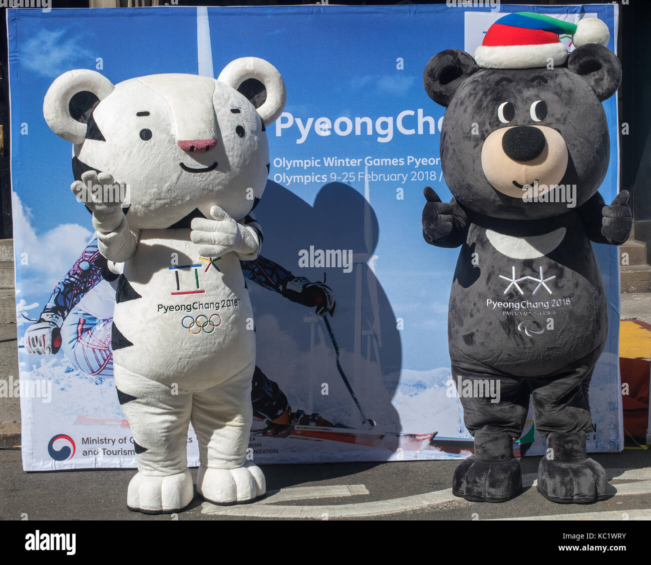 New York, USA, 1 October 2017. Soohorang (L) and Bandabi, the official mascots of the PyeongChang 2018 Winter Olympic and Winter Parlympic Games pose at a street fair in New York.  Soohorang is a symbol of strength and trust, and Korea’s guardian animal - the white tiger symbolizes protection to all the athletes and spectators at the 2018 Winter Games. Bandabi is a symbol of strong will and patience, and of the host province of Gangwon. The Asiatic black bear embodies the spirit of the paralympics. Photo by Enrique Shore/Alamy Live News Stock Photo