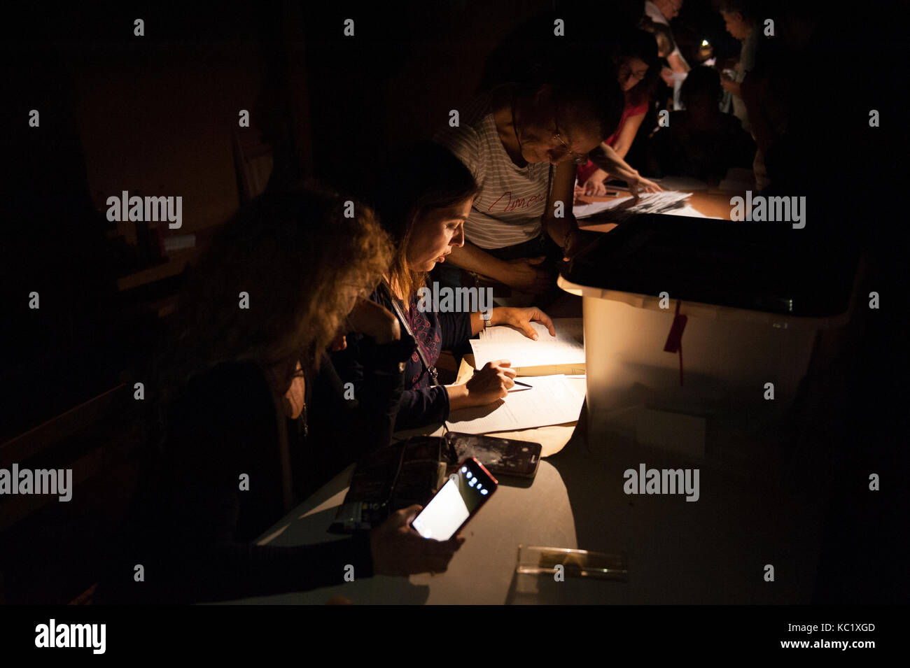 Barcelona, Catalonia. October 1, 2017. During the counting process, the lights have been turned off to make the location of the police more difficult.The vote counting begins, shuffle data of participation of 3,000,000 people. Credit: Charlie Perez/Alamy Live News Stock Photo