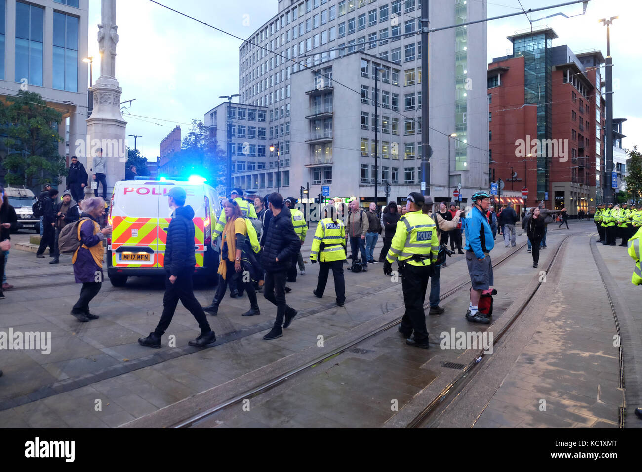 St Peters Square, Manchester, UK - Sunday 1st October 2017 - A Police van takes away one arrested demonstrator as Police deal with protesters outside the Conservative Party Conference. Photo Steven May / Alamy Live News Stock Photo
