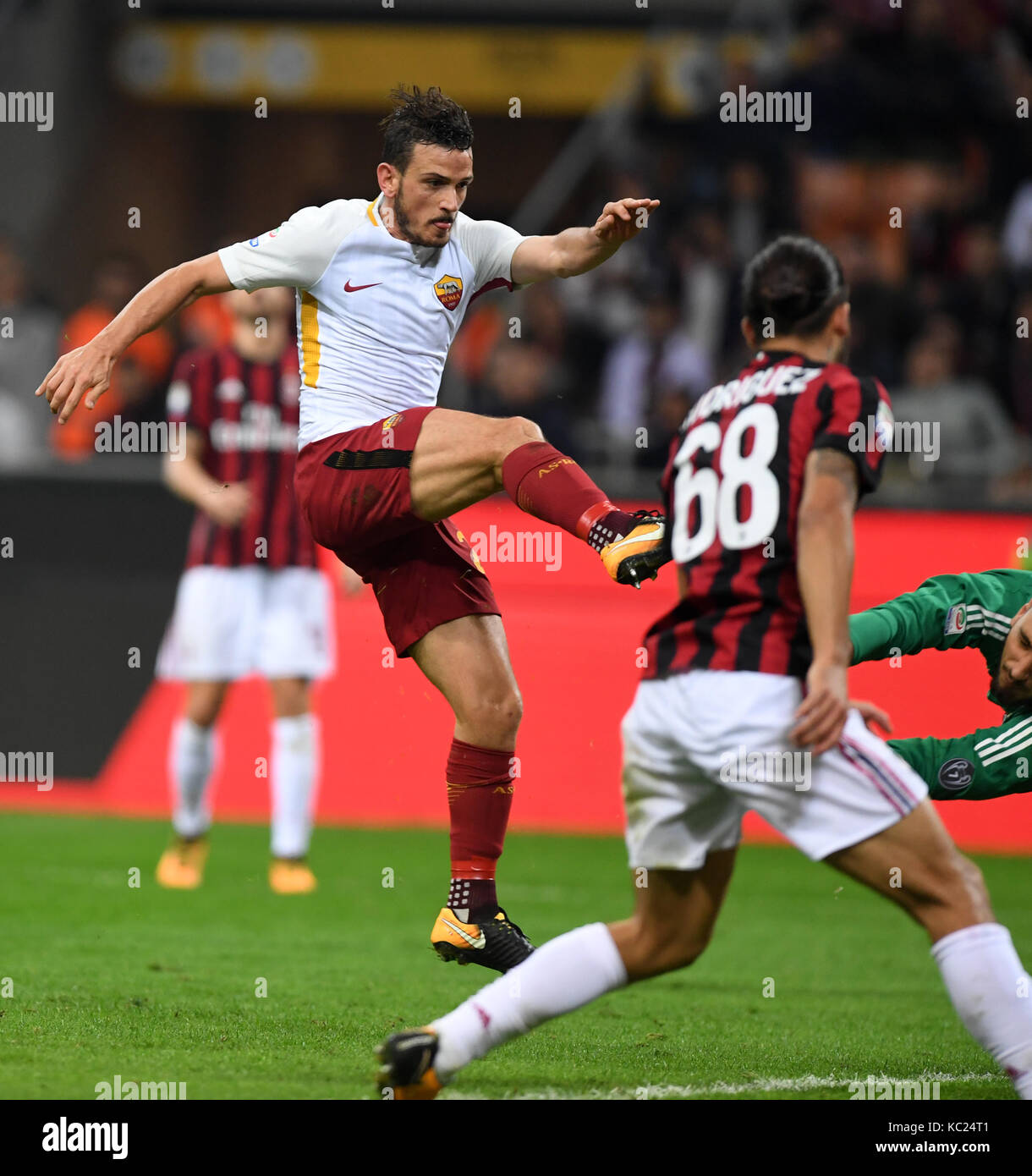 Rome. 2nd Oct, 2017. Roma's Alessandro Florenzi (L) scores during a Serie A soccer match between AC Milan and Roma in Milan, Italy, Otc. 1, 2017. Roma won 2-0. Credit: Alberto Lingria/Xinhua/Alamy Live News Stock Photo