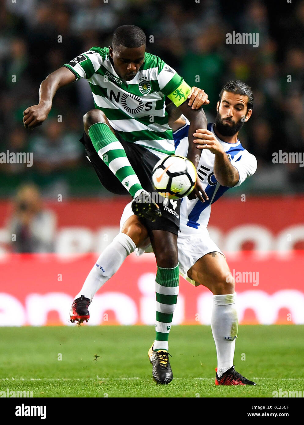 Lisbon. 1st Oct, 2017. Sporting's William Carvalho (L) vies with Porto's Sergio Oliverira during the Portuguese League soccer match between Sporting CP and FC Porto at the Alvalade stadium in Lisbon, Portugal on Oct. 1, 2017. The match ended with a 0-0 draw. Credit: Zhang Liyun/Xinhua/Alamy Live News Stock Photo