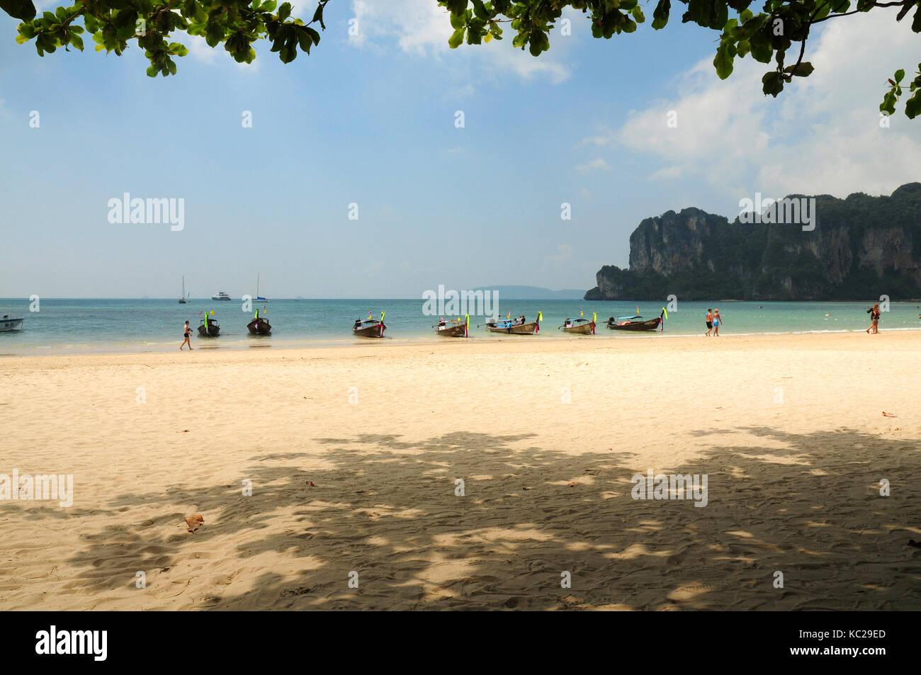 Long tail boats lined up along the shore on Krabi island, Thailand Stock Photo