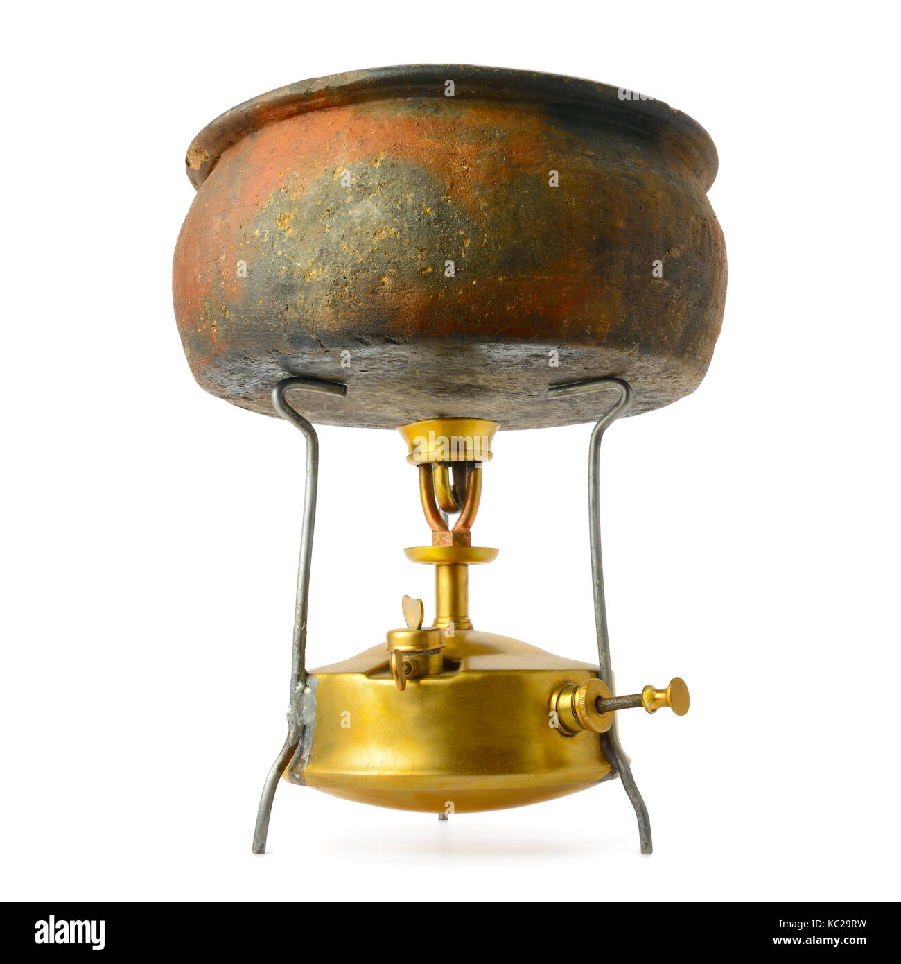 Ancient pot on the primus stove isolated on white background Stock