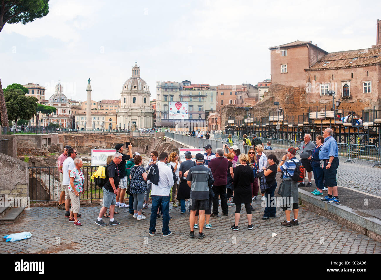 Group of tourists visiting Roman ruins in Rome, Italy Stock Photo - Alamy