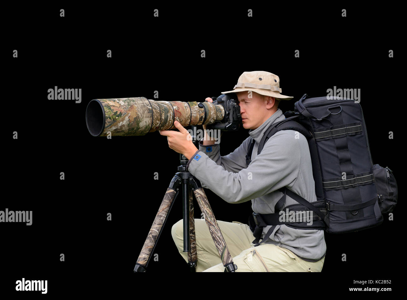 Professional wildlife photographer isolated on black background Stock Photo