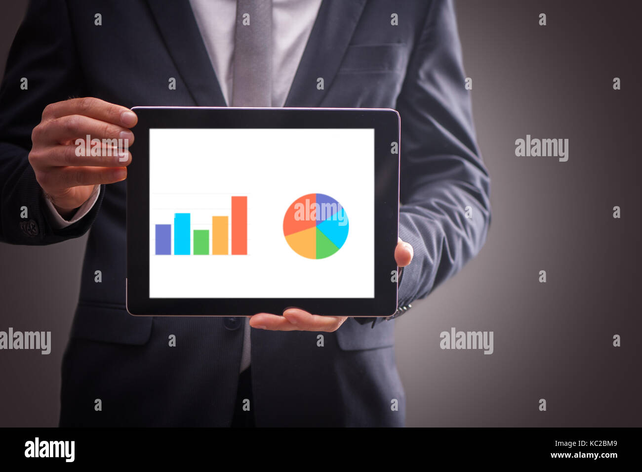 businessman and tablet with business chart Stock Photo - Alamy