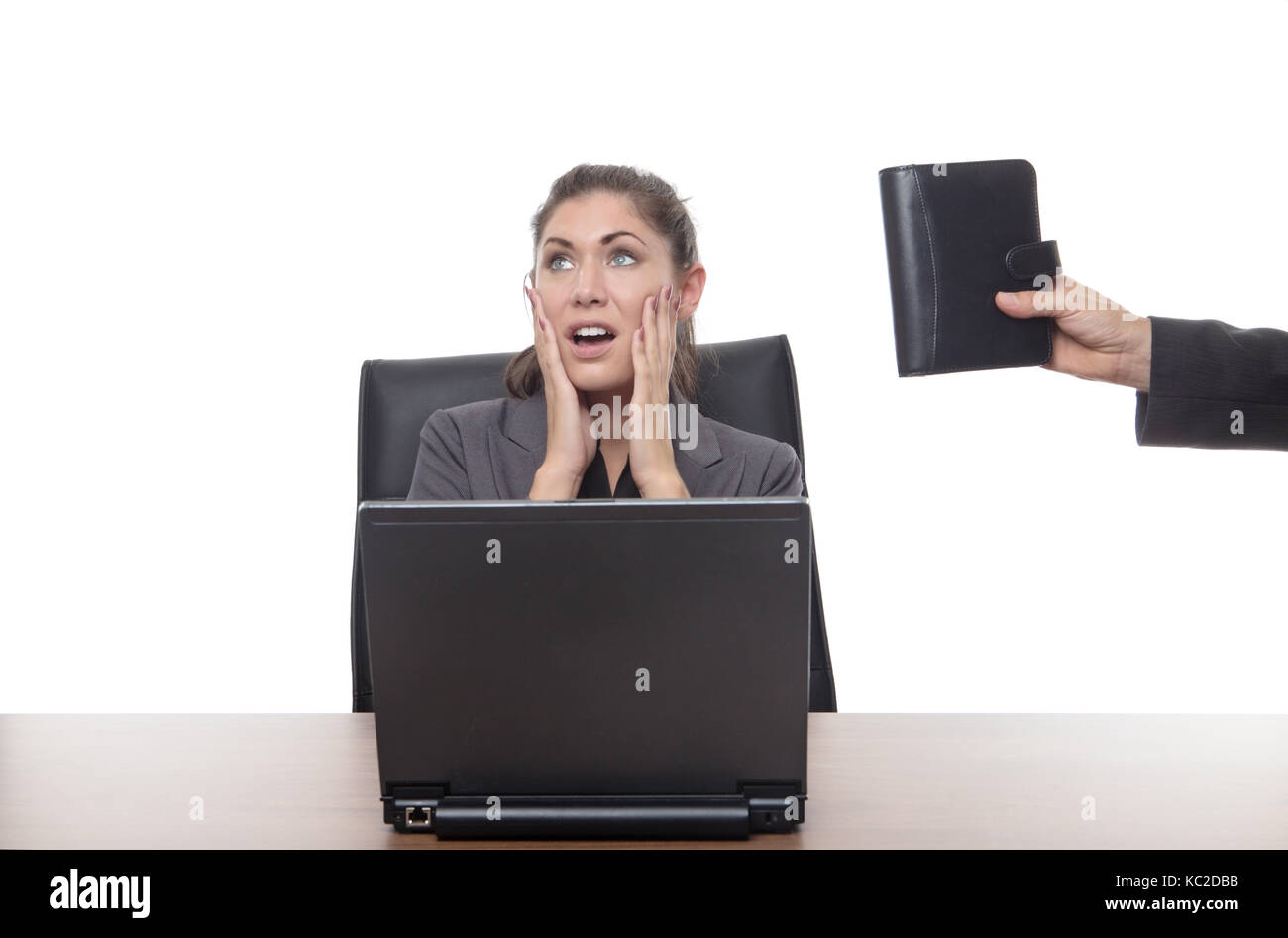 stressed out business woman sitting at her desk Stock Photo