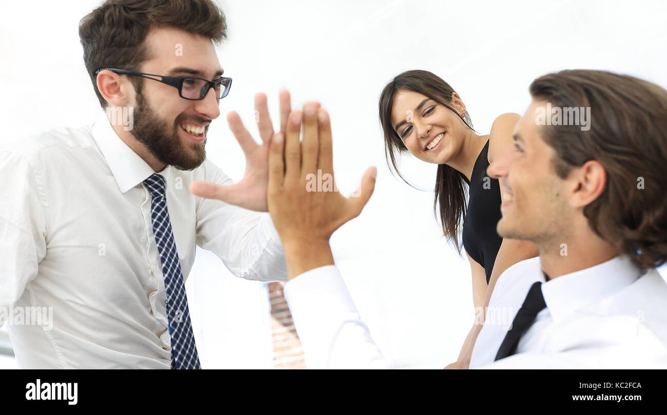 business colleagues giving each other high five Stock Photo - Alamy