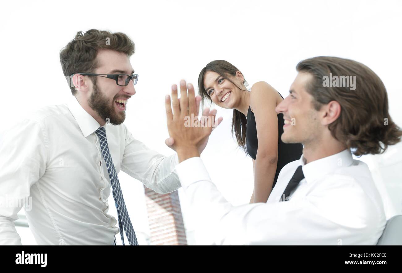business colleagues giving each other high five Stock Photo - Alamy