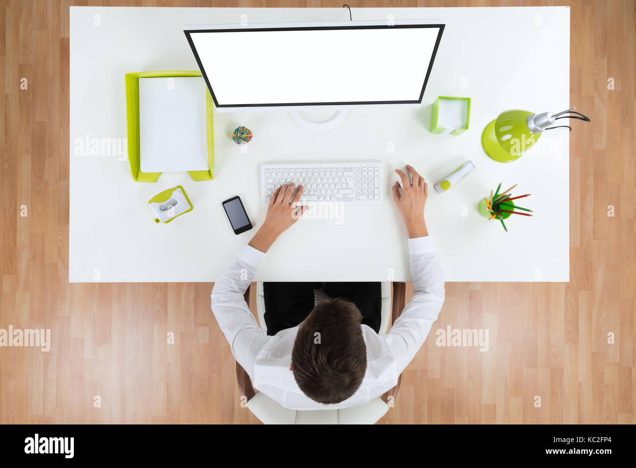 High Angle View Of Businessman Working On Computer Showing Blank ...