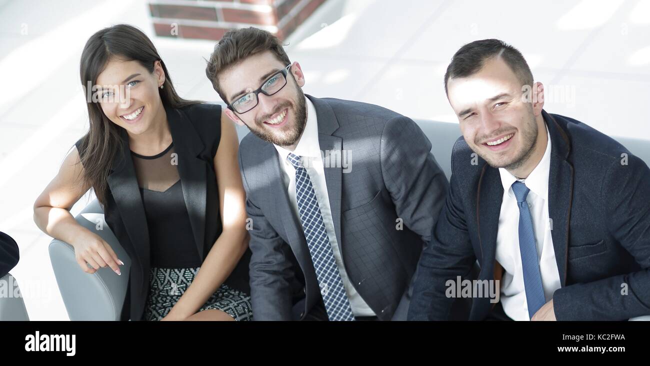 portrait of successful business team sitting in office lobby Stock ...
