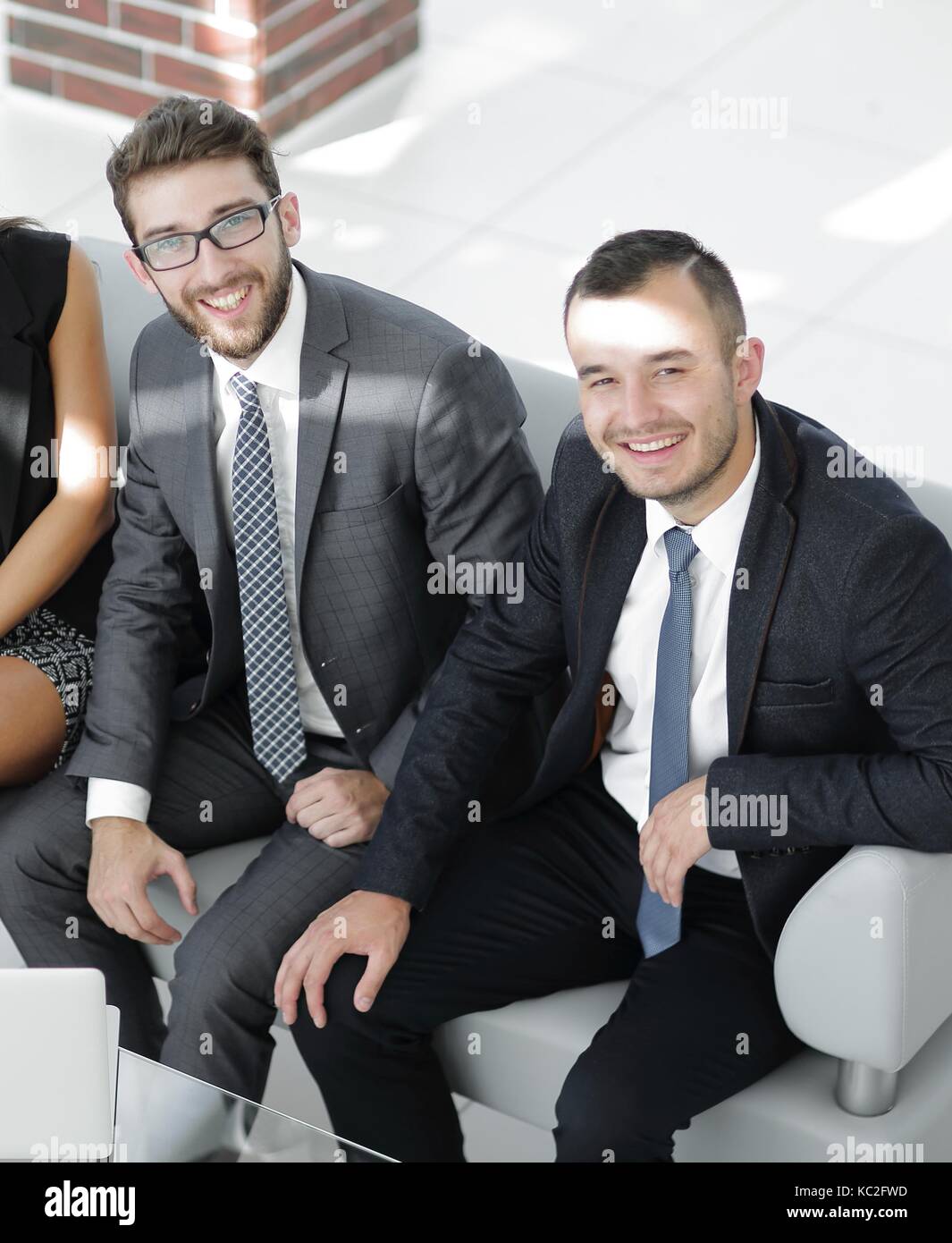 portrait of successful business team sitting in office lobby Stock ...