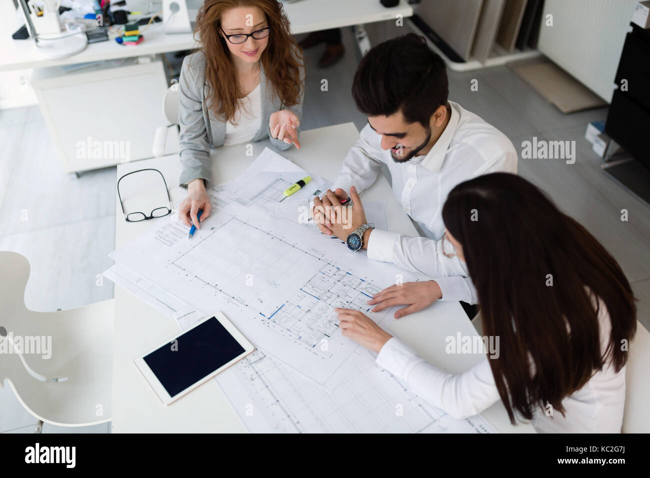 Group of architects working together on project Stock Photo