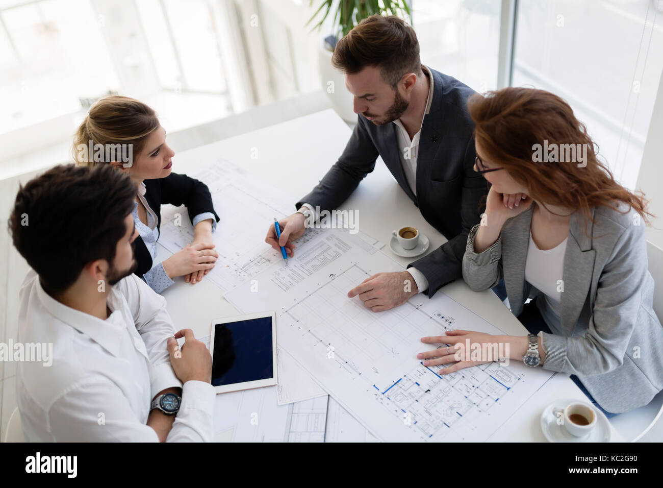 Group of architects working together on project Stock Photo