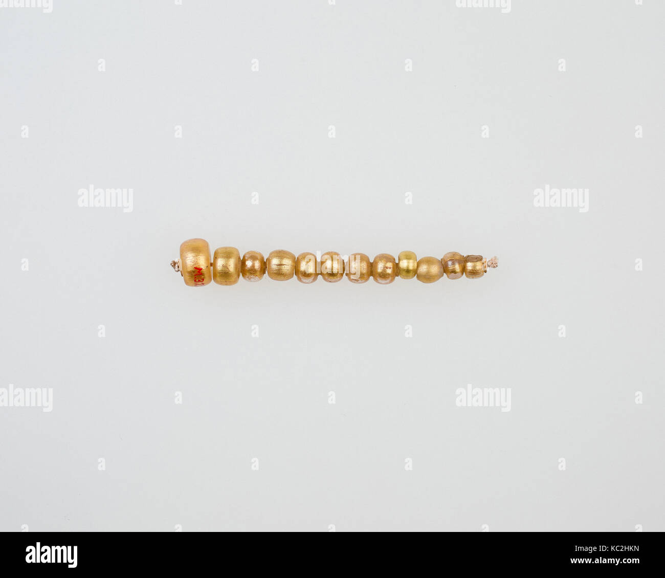 String of 12 elongated disc beads, 2nd century BC–2nd century AD Stock Photo