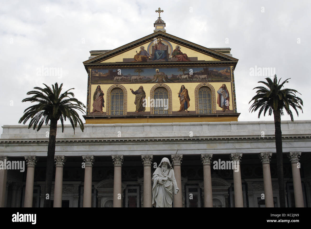 Italy. Rome. Exterior of Basilica of Saint Paul Outside the Walls. Reconstruction of Facade. Neoclassical style. Architect, Luigi Poletti (1792-1869) and St. Paul Statue by Giuseppe Obici. Stock Photo