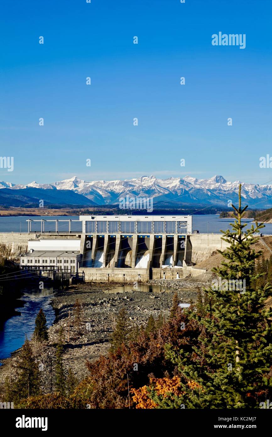 Vertical shot of Bearspaw dam and the Ghost Reservoir with mountain background Stock Photo