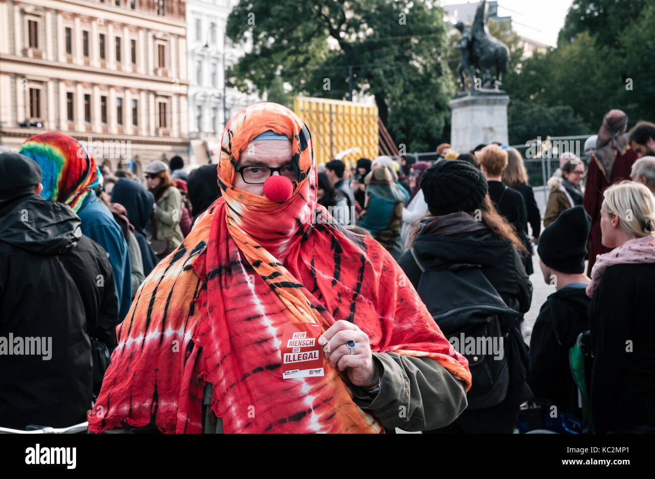 Vienna, Austria - October 1, 2017: People in costumes of mimes and clowns protest against Austrian ban on full-face veil in public places Stock Photo