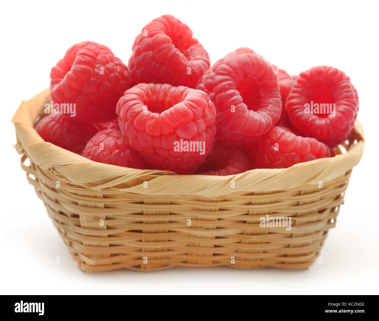 Fresh Raspberry in a basket over white background Stock Photo Alamy