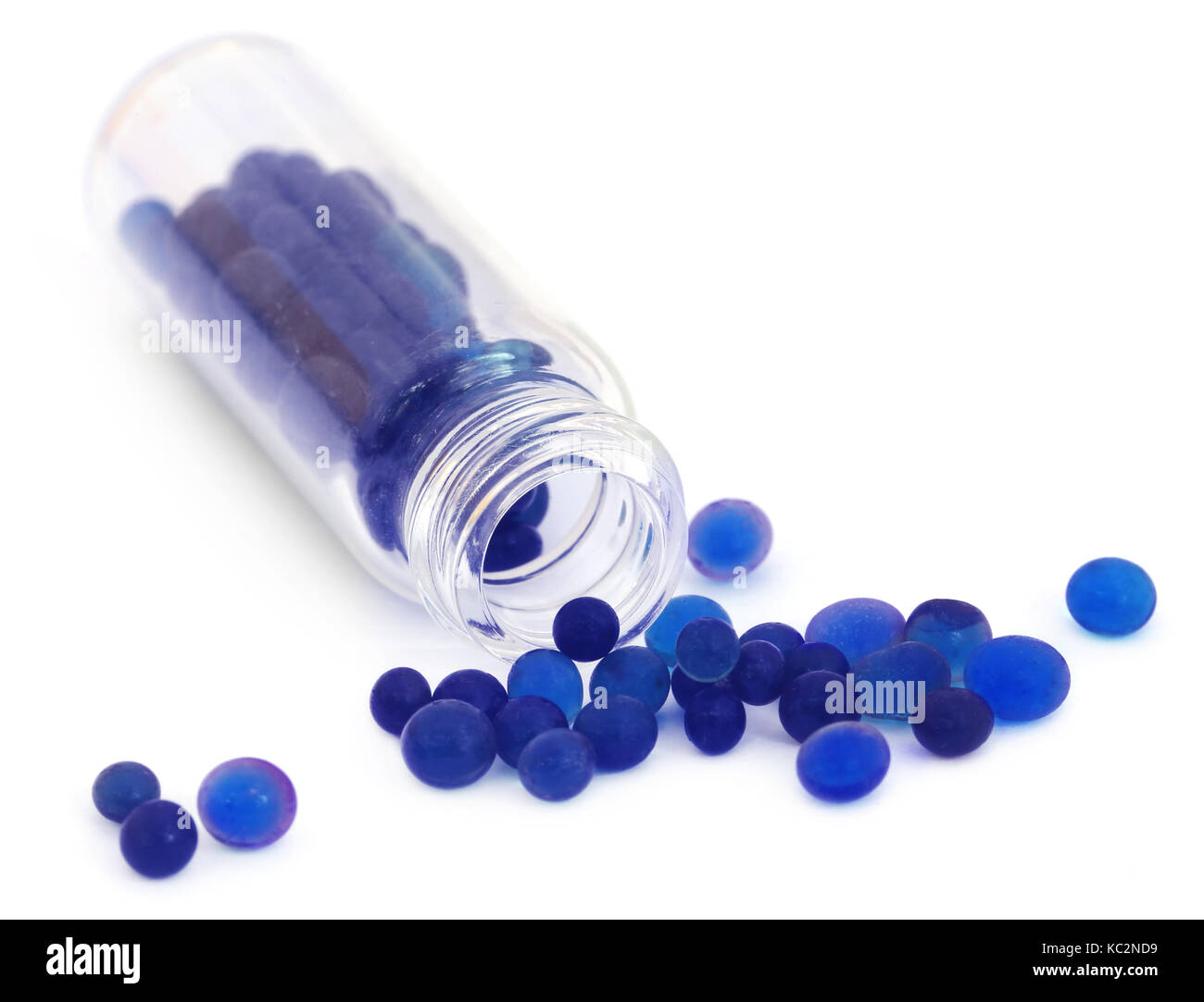 Silica gel used as water absorbent over white background Stock Photo