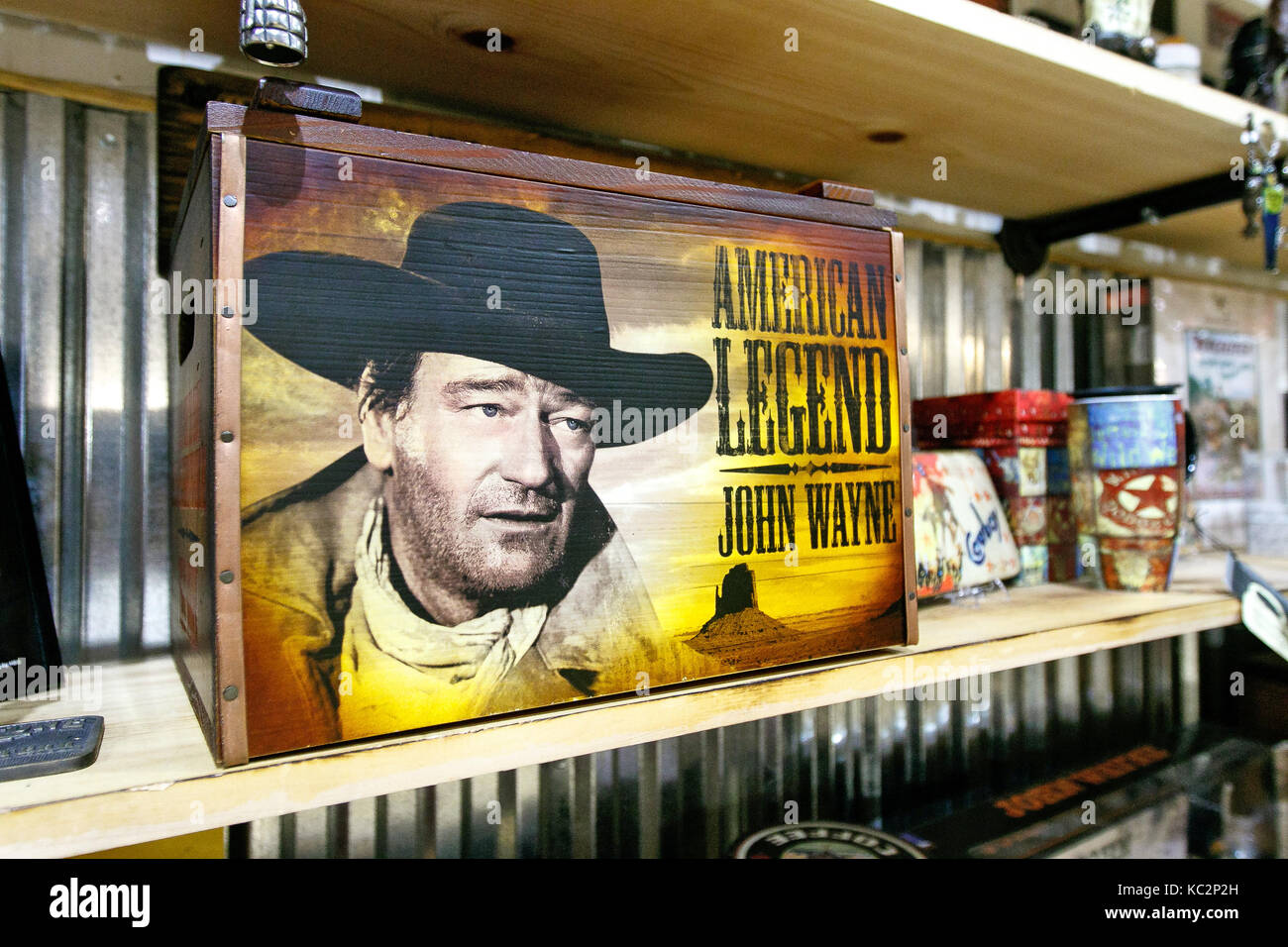 John Wayne themed merchandise is displayed on the shelves of a store in Manhattan. Stock Photo