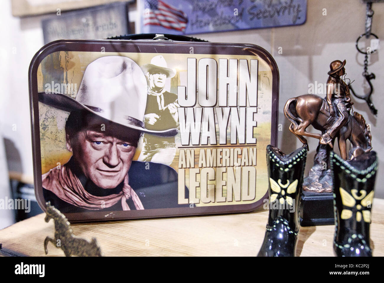 John Wayne themed merchandise is displayed on the shelves of a store in Manhattan. Stock Photo