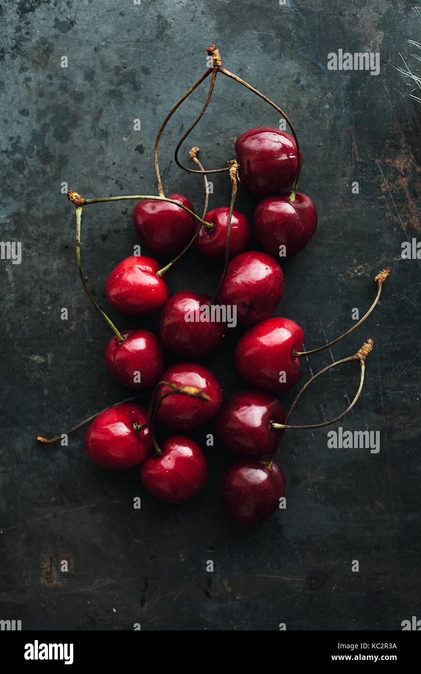 Ripe cherries on grunge background Stock Photo - Alamy