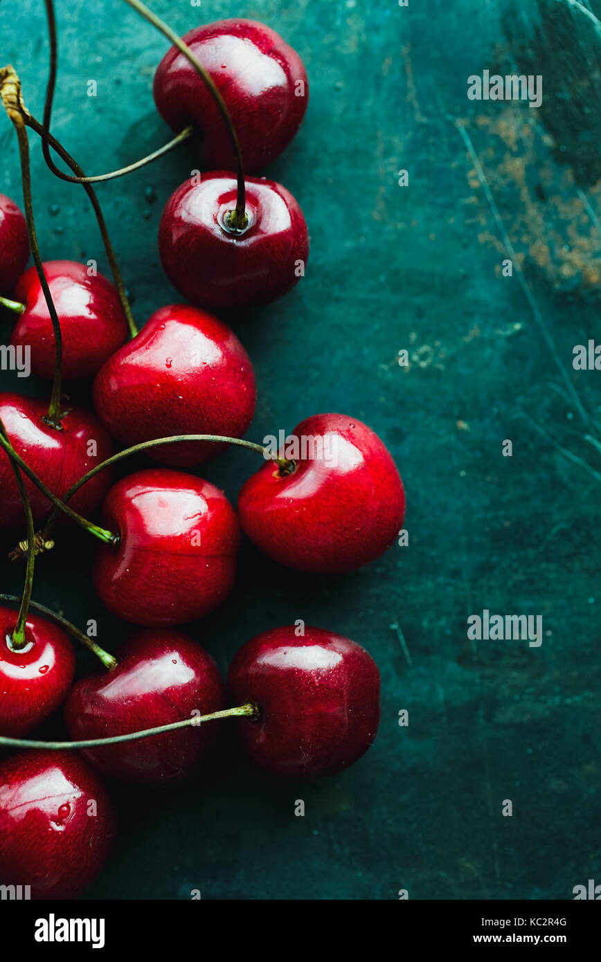 Ripe cherries on green Stock Photo - Alamy
