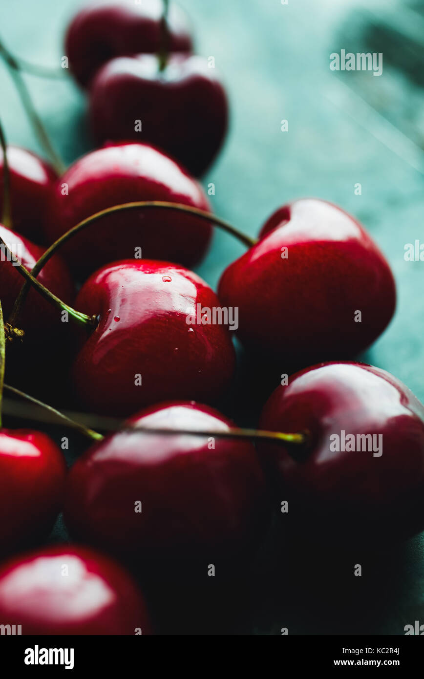 Ripe cherries on green Stock Photo - Alamy