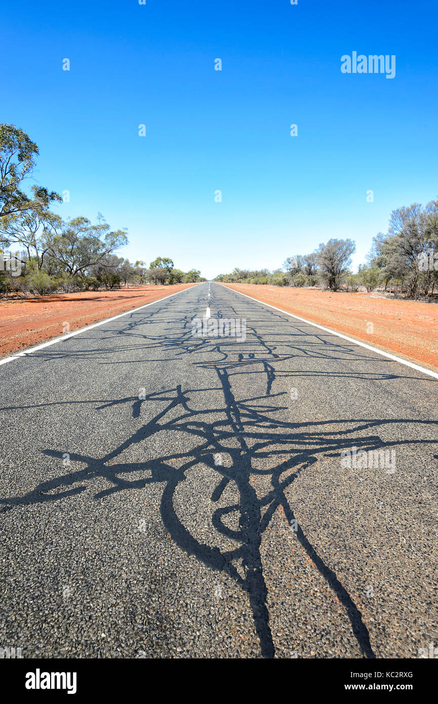 Heavily patched portion of the Mitchell Highway or Matilda Way near Bourke, New South Wales, NSW, Australia Stock Photo