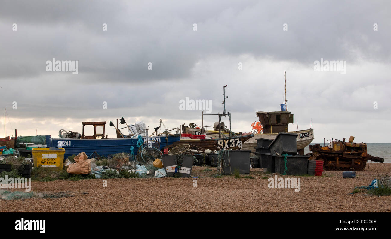 Fishing boats and gear on beach in Hastings, East Sussex, England Stock